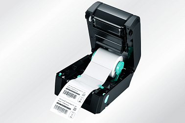 Принтер этикеток TSC TX200 с открытой крышкой